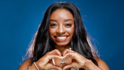 Simone Biles holding up heart sign