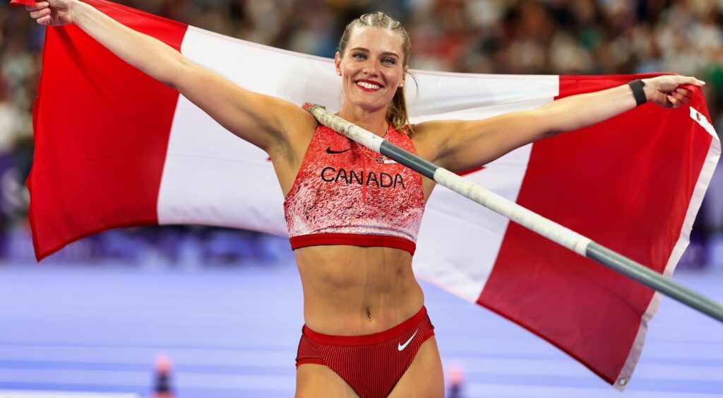 Alysha Newman holding Canadian flag