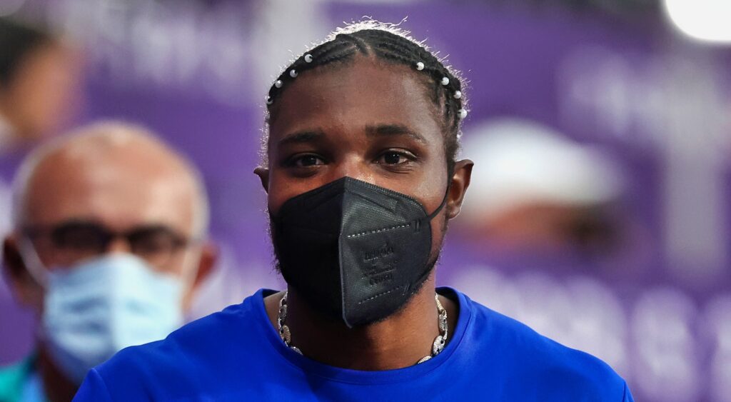 Noah Lyles looking on at Olympics.