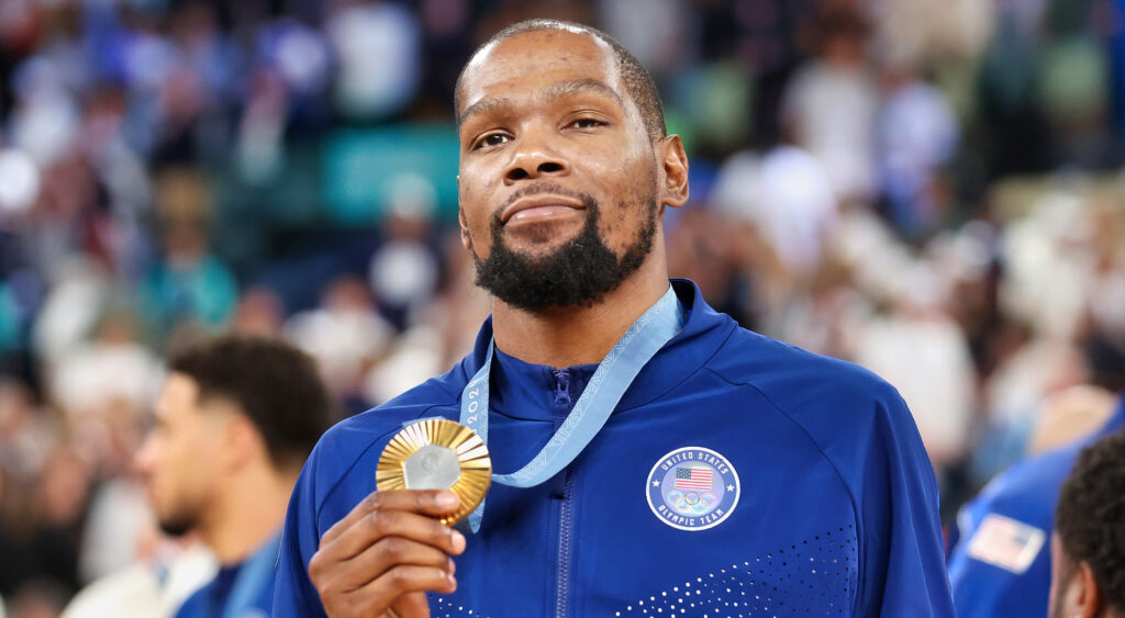 Kevin Durant holding gold medal up