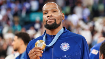 Kevin Durant holding gold medal up