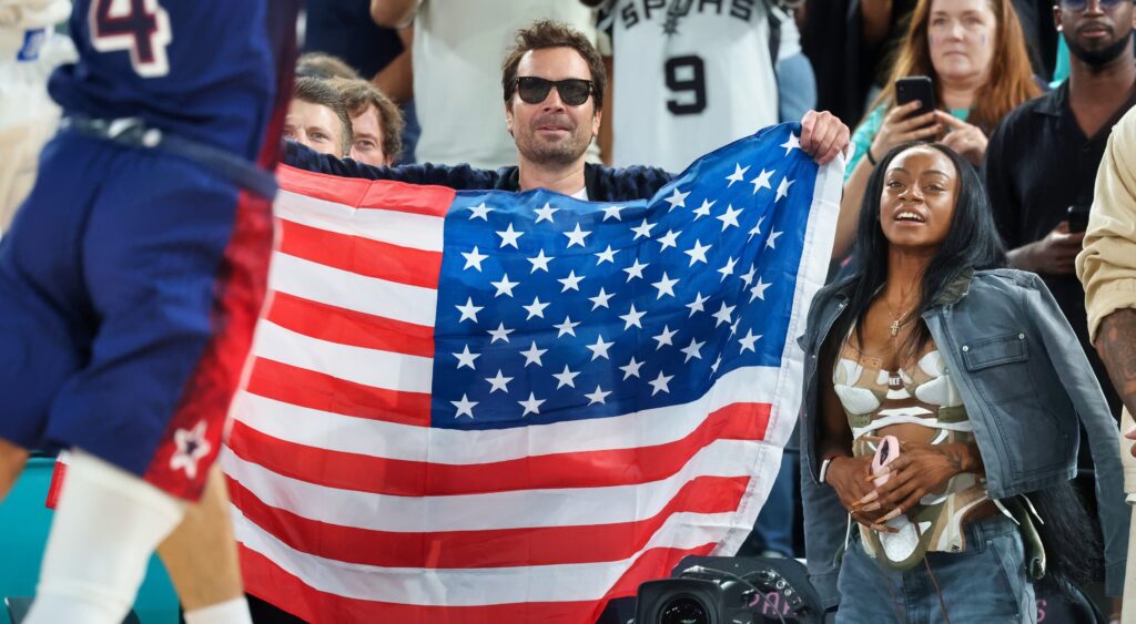 Jimmy Fallon holding American flag