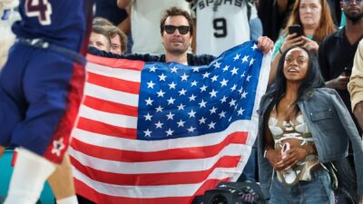 Jimmy Fallon holding American flag