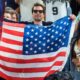 Jimmy Fallon holding American flag