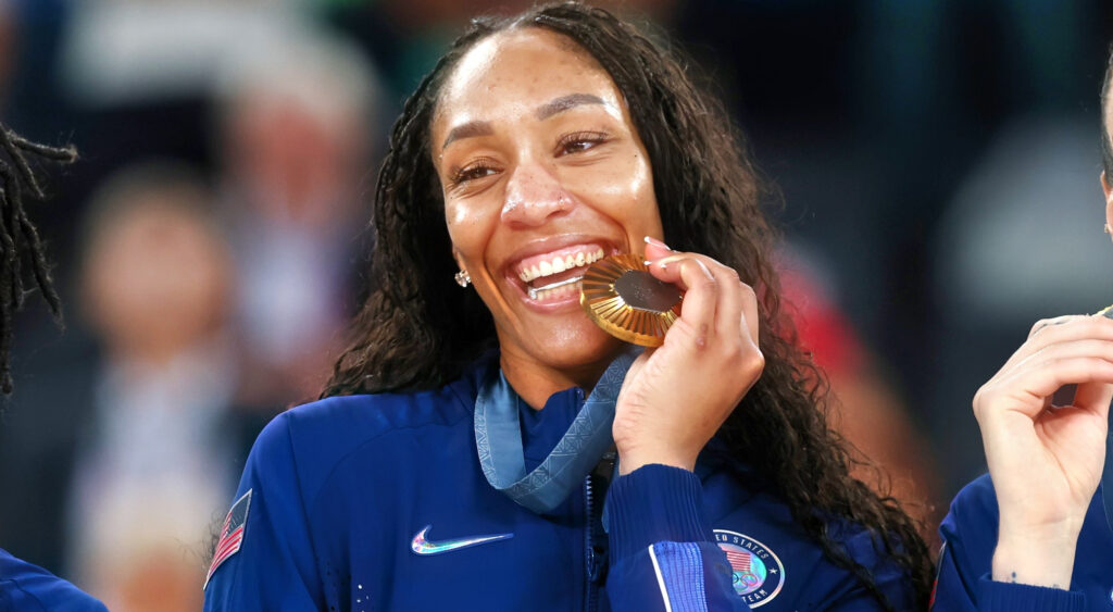 A'Ja Wilson biting gold medal