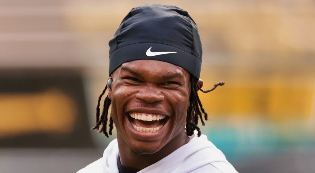 Travis Hunter of Colorado Buffaloes looking on.