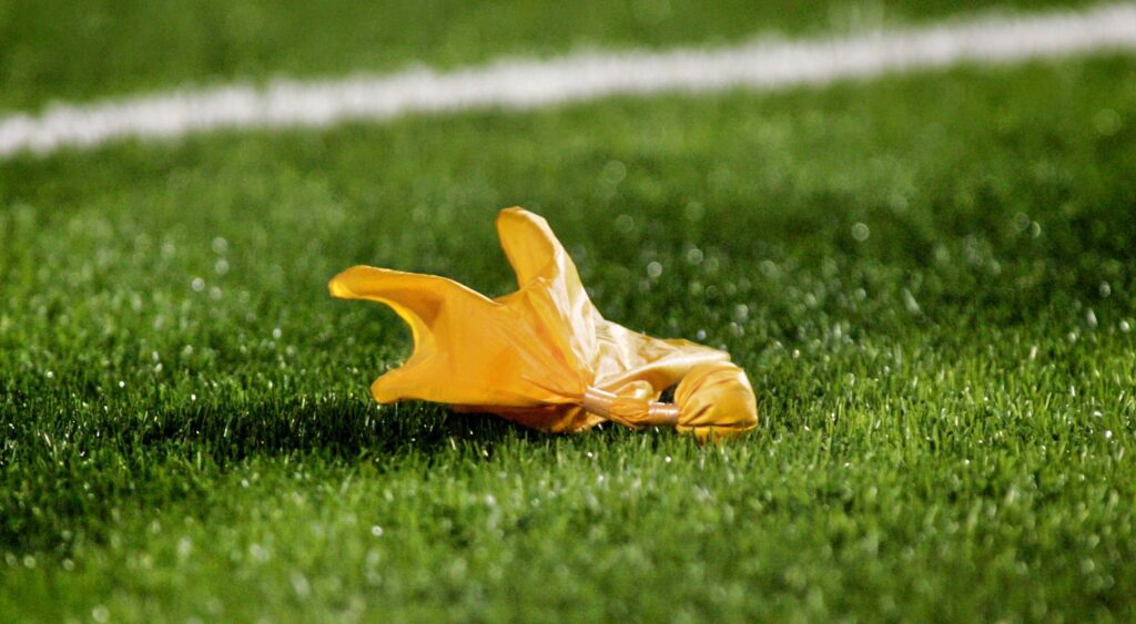 Penalty flag on the field during the game between the Oklahoma State Cowboys and the Texas Tech Red Raiders