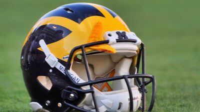 Michigan Wolverines football helmet on ground