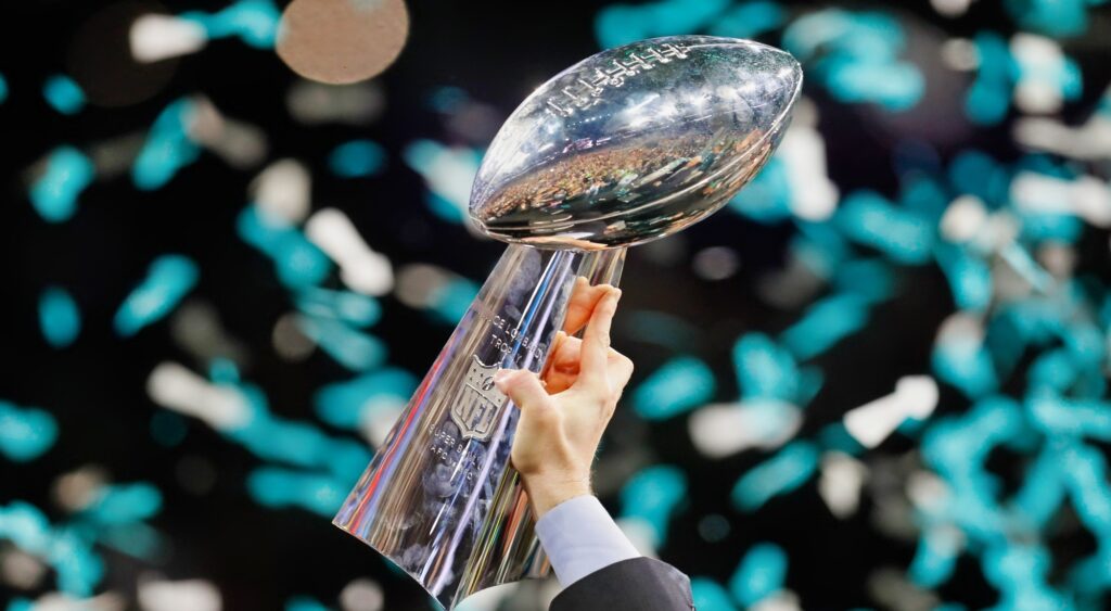 Super Bowl trophy held in air after Nick Foles' Philadelphia Eagles won the game.