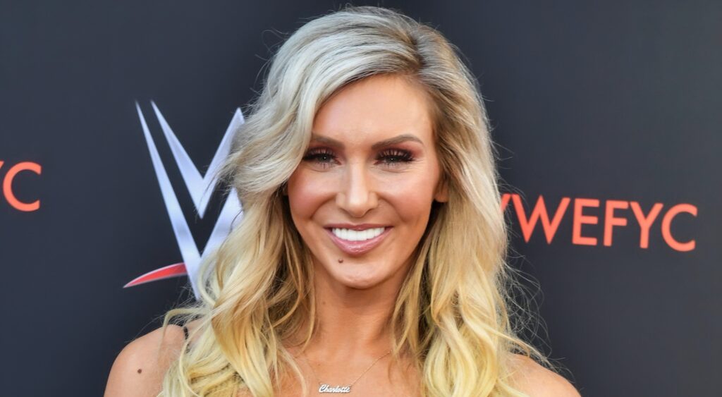 Charlotte Flair posing at WWE red carpet event.