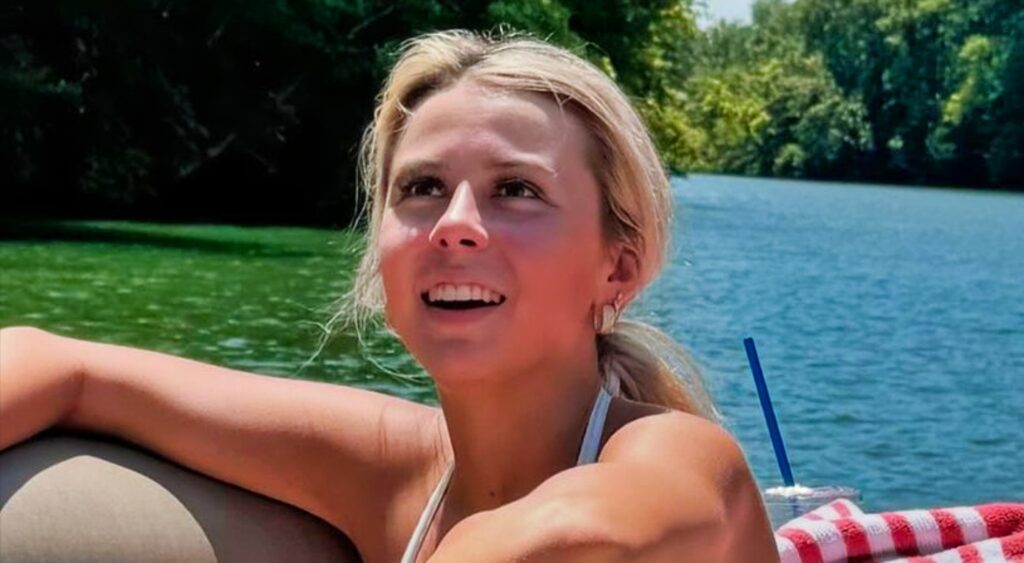 Haliey Welch on a boat on the lake.