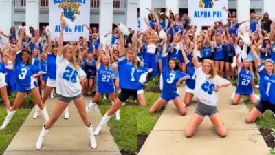 Kentucky Wildcats Alpha Phi members dancing in jerseys