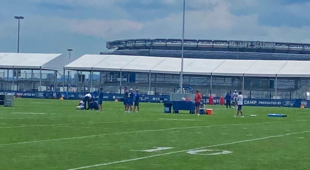 Malik Nabers on the field getting attended to during Giants practice.