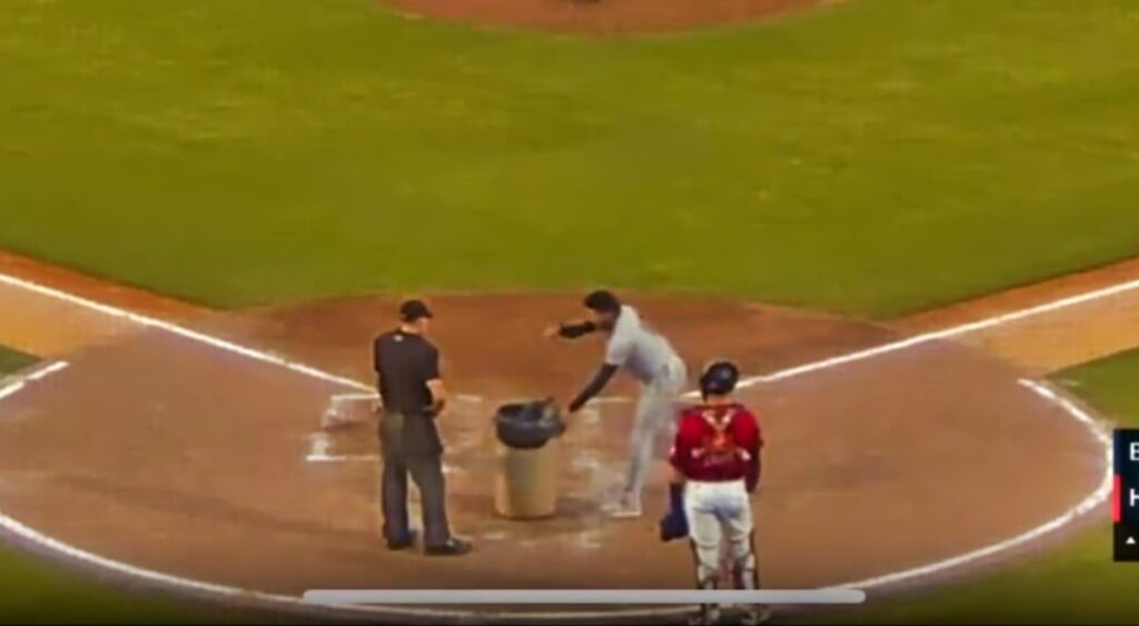 Rafael Valenzuela with trash can yelling at umpire