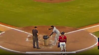 Rafael Valenzuela with trash can yelling at umpire