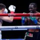 Terence Crawford smiles at Israel Madrimov during the tenth round