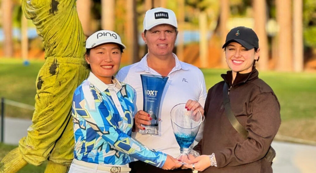 Hailey Davidson posing with trophy