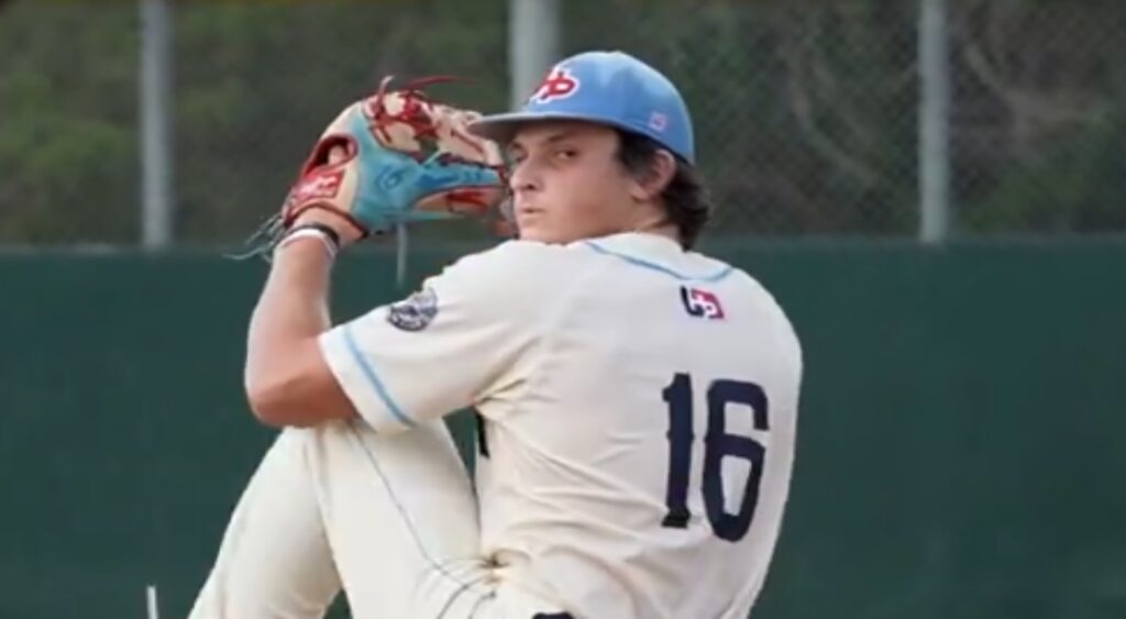 Kade Johnson preparing to throw a pitch in baseball game.