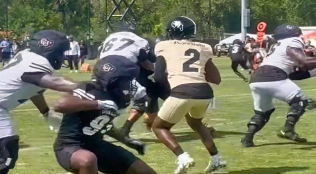 Shedeur Sanders of Colorado Buffaloes attempting a pass.