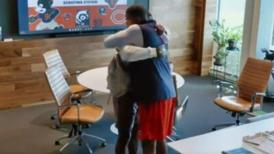 Adrian Colbert and Ryan Poles hugging