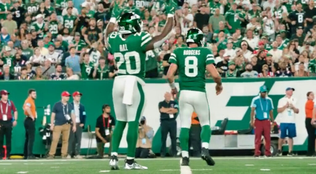 Breece Hall and Aaron Rodgers celebrating play