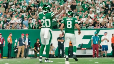 Breece Hall and Aaron Rodgers celebrating play