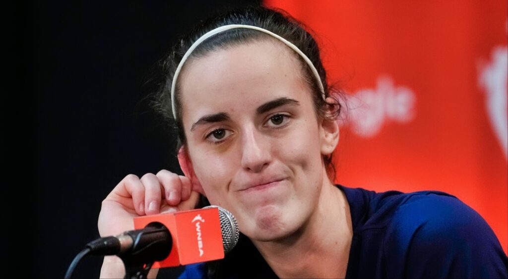 Caitlin Clark looks on during a press conference.