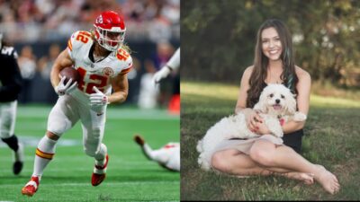 Carson Steele in uniform and Kesslar posing with dog