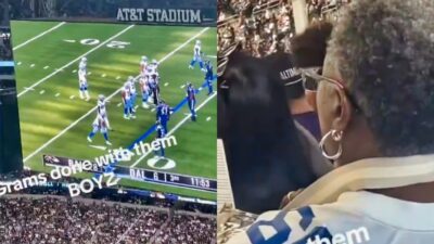 Dallas Cowboys fan reading a book inside stadium