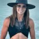 Danica Patrick posing in black outfit