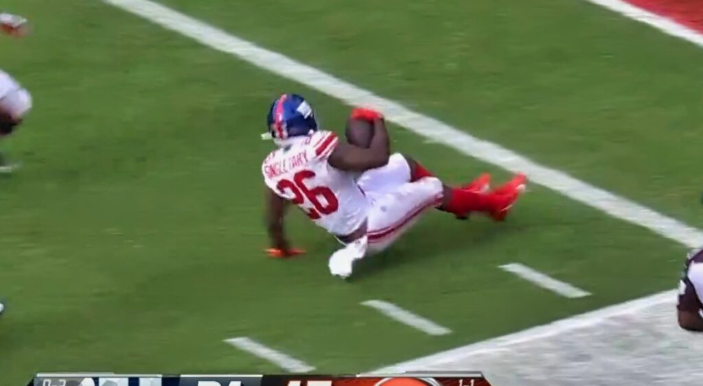 Devin Singletary sliding on turf