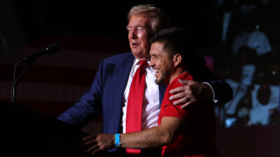 Donald Trump, embraces MMA fighter