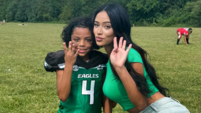 Football Mom posing with son