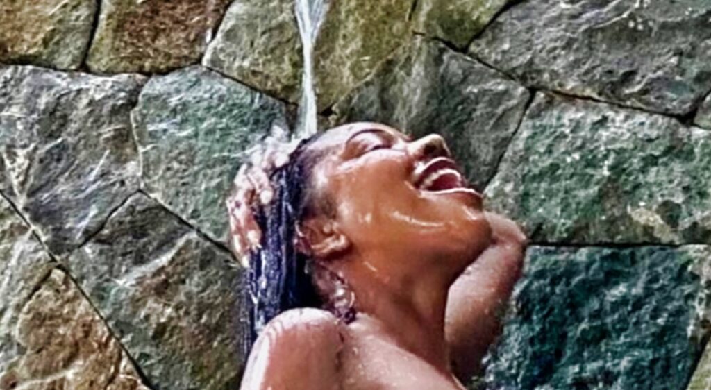 Gabrielle Union showering outside.