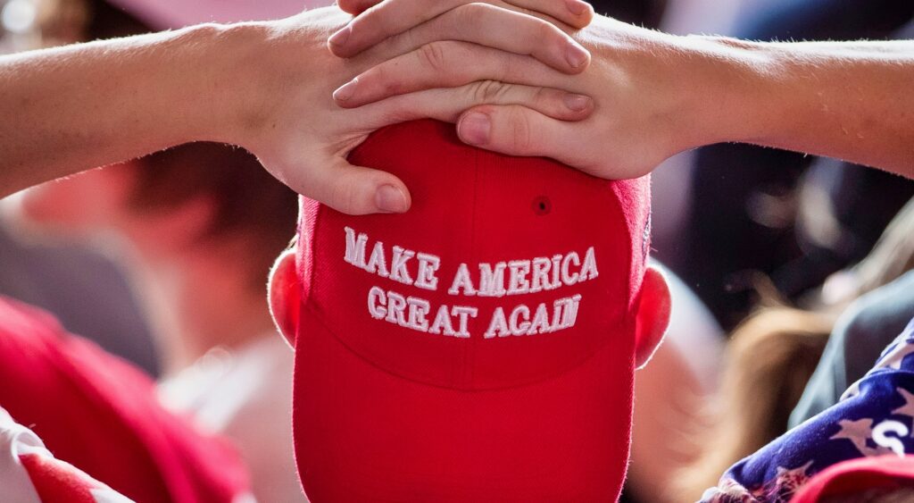 Person wearing a MAGA hat.