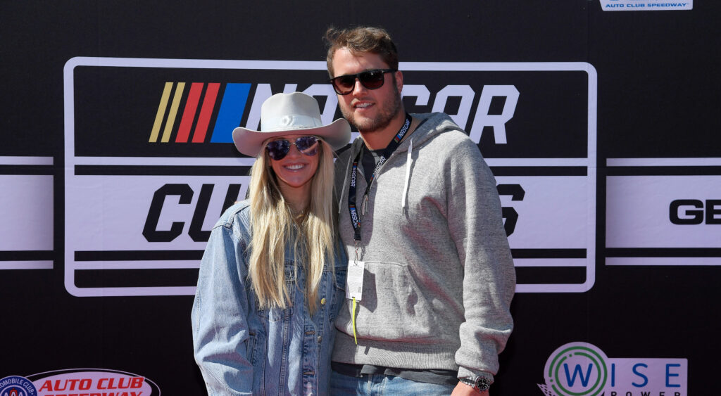 Kelly and Matthew Stafford attending a NASCAR event