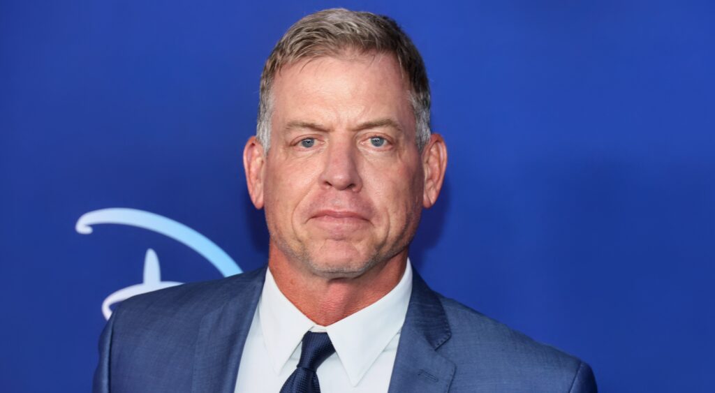 Troy Aikman posing in suit