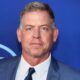 Troy Aikman posing in suit