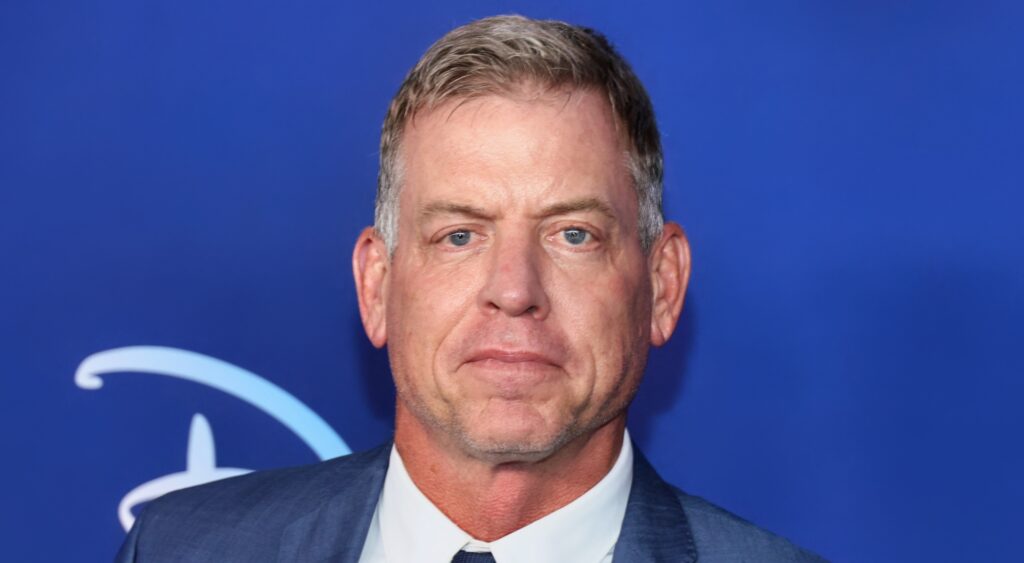 Troy Aikman looking on at event.