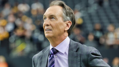 Cris Collinsworth looking upward