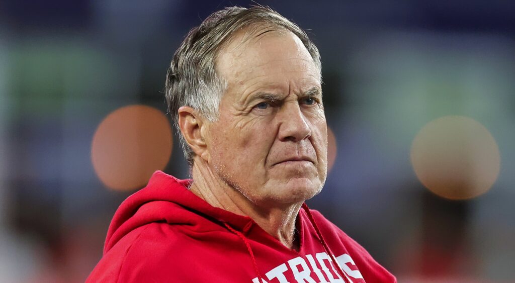 Bill Belichick looks on.