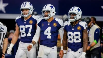 Dak Prescott, CeeDee Lamb, and Jake Ferguson in uniform