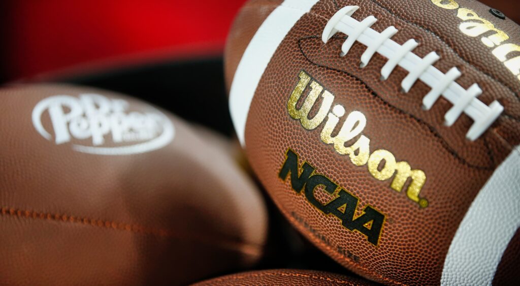 NCAA Footballs. The New Mexico State Aggies' OC has been suspended.