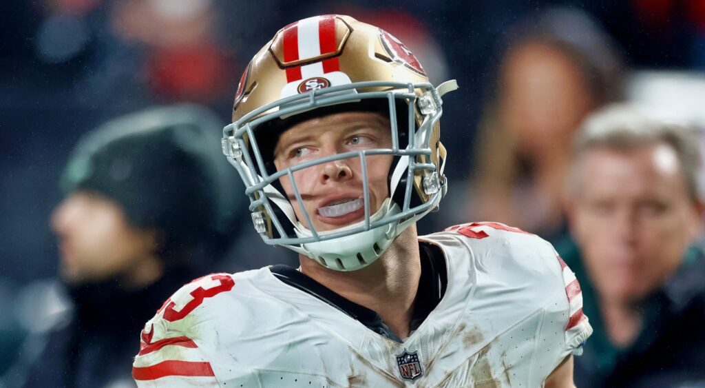 Christian McCaffrey of San Francisco 49ers looking on.