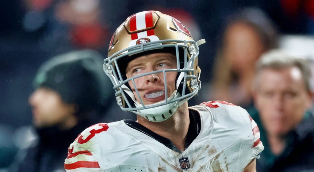 Christian McCaffrey of San Francisco 49ers looking on.