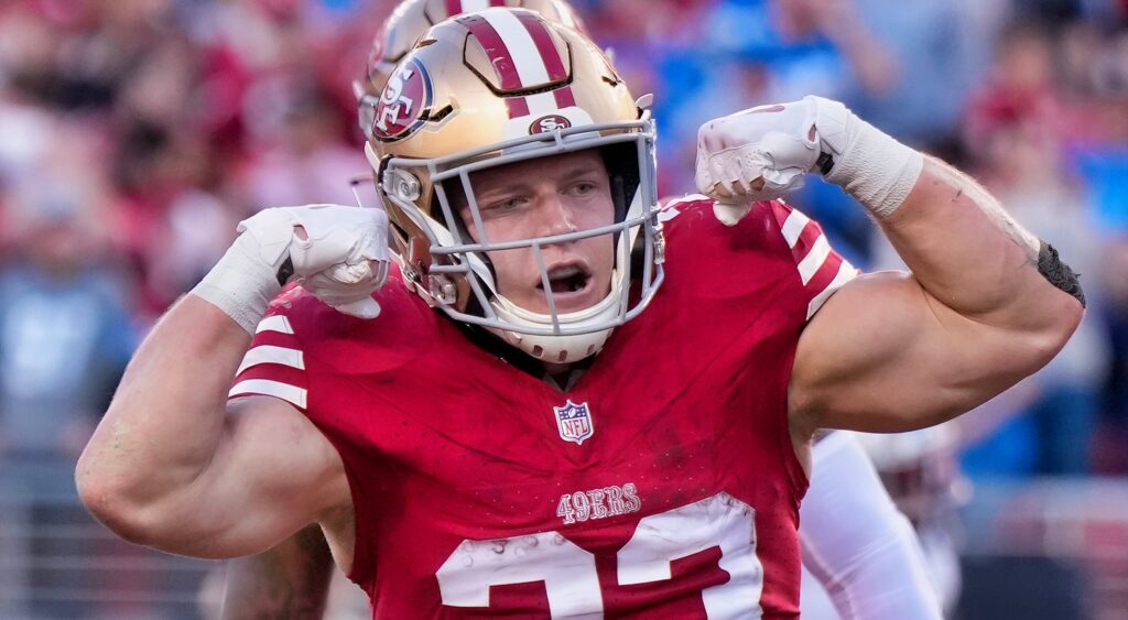 Christian McCaffrey flexing muscles