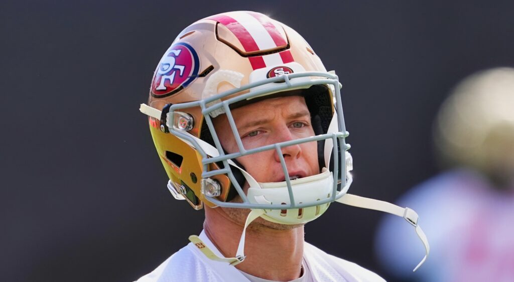 Christian McCaffrey of San Francisco 49ers looking on.