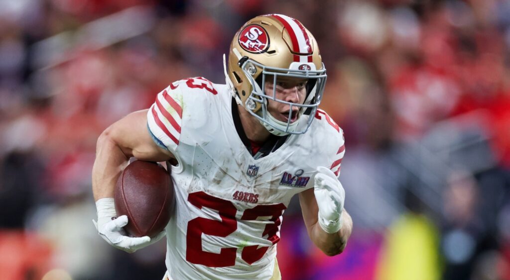 Christian McCaffrey of San Francisco 49ers running with football.