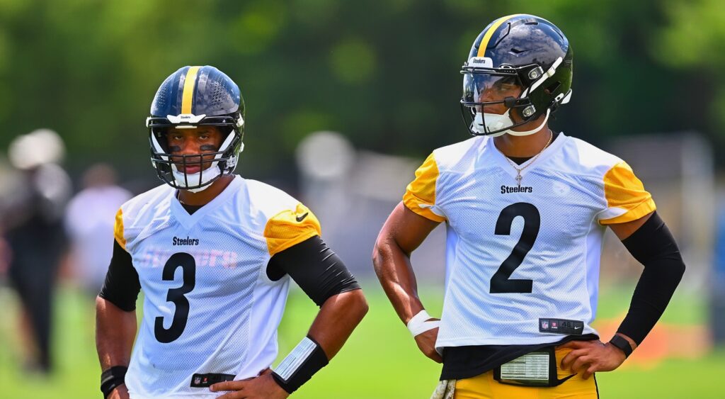 Russell Wilson and Justin Fields of Pittsburgh Steelers looking on.