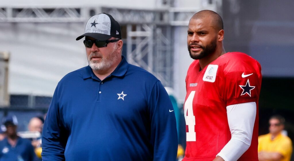 Mike McCarthy and Dak Prescott looking on during Dallas Cowboys practice.